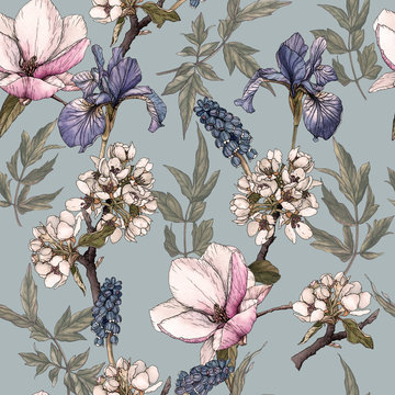 Floral seamless pattern with watercolor irises, magnolia, cherry blossom and muscari.