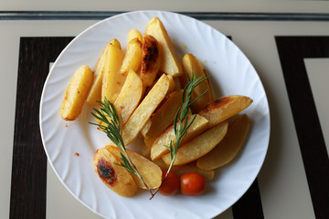 Baked Potatoes with Rosemary and tomatoes