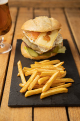Cheeseburger with potatoes and beer