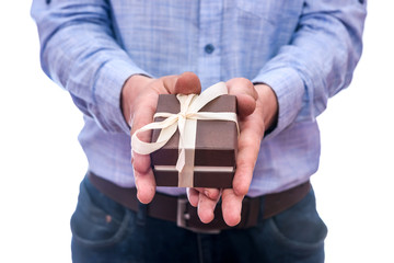 Male hands with gift box isolated on white © RomanR