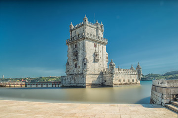 Fototapeta na wymiar Lisbon, Portugal. Belem Tower Torre de Belem is a fortified tower located at the mouth of the Tagus River.