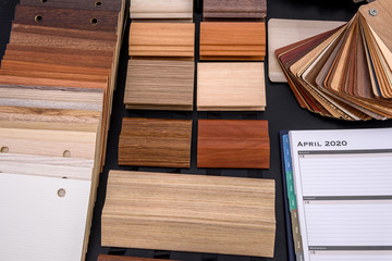 Notepad with wooden sampler on the table