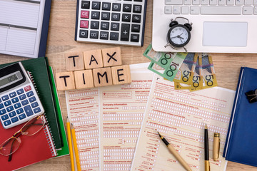 Australian 'tax time', tax form with money on table