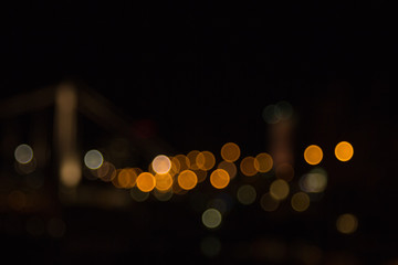 Fototapeta premium blurry lights of a big city at night. Background for travel photos. bokeh advertising poster