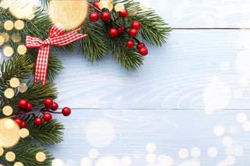 Pine tree branches with red holly berries
