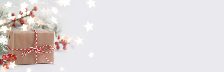 Christmas gift box and red holly berries