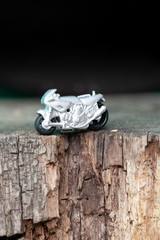 Small toy gray sports bike.