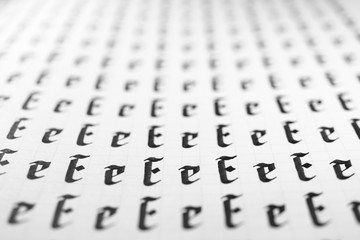 Calligraphy black and white letters E background. Lettering practice writing worksheet. Handwriting...
