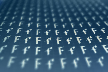 Calligraphic white on dark blue letter F learning skills paper page. Calligraphy letters F...