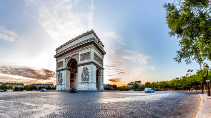 Paris Triumphal Arch the Arc de Triomphe de l’Etoile at the western end of the Champs-Elysees at the centre of Place Charles de Gaulle, France. Early morning with nice sunrise light