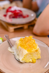 Traditional Slovenian dessert made of dough, cheese and fruit. Dumplings with mango for a delicious breakfast in a European cafe.