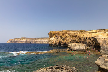 Panorama view at the coast of Dwejra Bay with the ruin of Azure Window on Gozo island in Malta