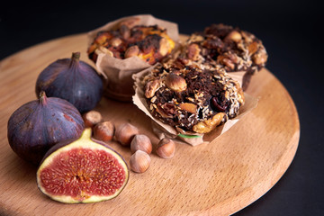 delicious fresh muffins and figs and hazel lie on the board