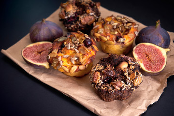 delicious fresh muffins and figs lie on paper