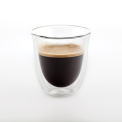 The glass of coffee isolated on white background. Top view at an angle. For design.