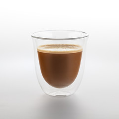 The glass of coffee isolated on white background. Top view at an angle. For design.