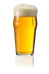 Glass of blonde beer with foam