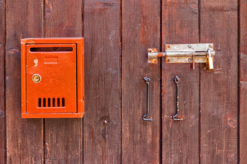 Wooden gate with a mailbox