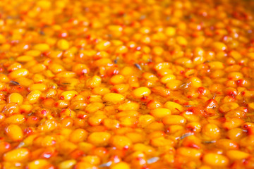 Fresh sea buckthorn jam. Close-up. Background. Texture.