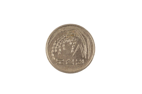 A close up image of a South Korean, fifty won coin isolated on a clean, white background