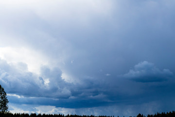 Beautiful clouds with blue sky background. there is darker on it that the storm front will bring.