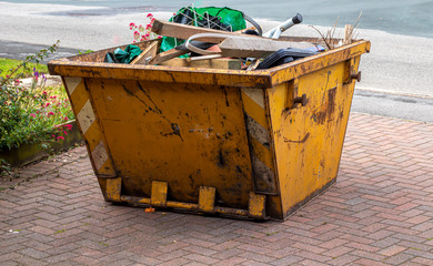 An open topped skip awaiting collection