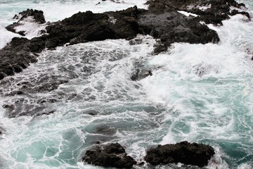 waves crashing on the rocks