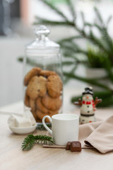 Bar counter in a coffee shop with New Year's decorations, cookies, sweets and coffee
