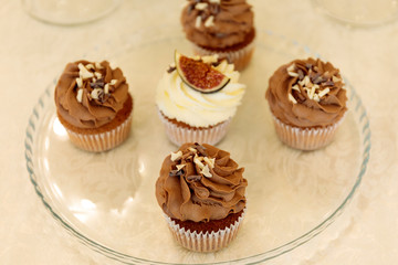 Variety of tasty appetizing sweet desserts with cream, berries and pastry on the grand wedding table.