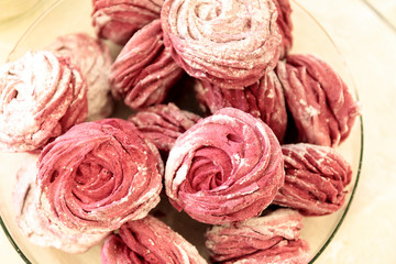 Variety of tasty appetizing sweet desserts with cream, berries and pastry on the grand wedding table.