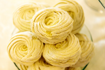 Variety of tasty appetizing sweet desserts with cream, berries and pastry on the grand wedding table.