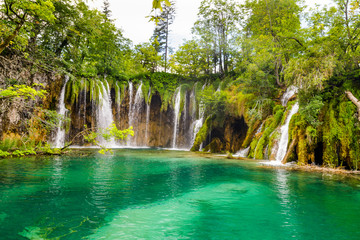 Beautiful view of the most famous waterfalls in the sunshine in Plitvice National Park, Croatia