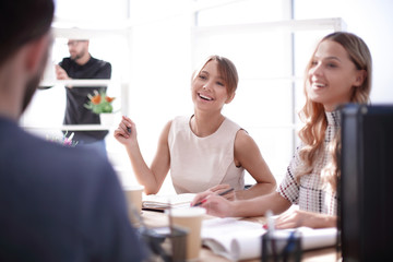 Fototapeta premium young business woman sitting at office Desk