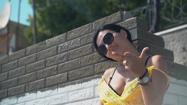 Young beautiful girl show middle fingers