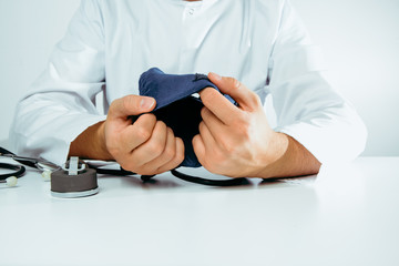 A doctor is doing a blood pressure monitor. Medical and pharmaceutical concept. Blood pressure test, hypertension problems, treatment. Heart attack, blood clots.