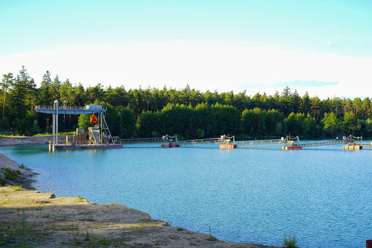 Schwimmbagger mit Transportband