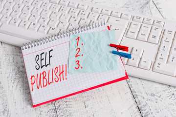 Text sign showing Self Publish. Business photo showcasing writer publish piece of ones work independently at own expense notebook paper reminder clothespin pinned sheet white keyboard light wooden