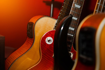 A set of classical and electric guitars. Music concept. Guitars for musicians, sale of guitars, musical instruments. Playing musical instruments, creating.
