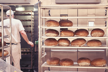 Man baking bread in the bakery