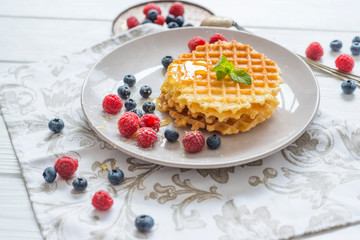  belgian waffles breakfast with honey and berries blueberries raspberries