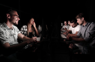 business team holds a working meeting at night