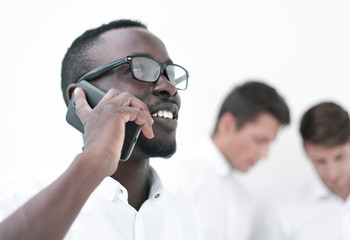 close up.successful businessman talking on mobile phone