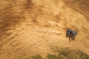 Aerial view of Quad bikes driving in the sand . © valdisskudre