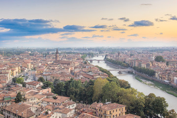 Obraz premium Beautiful view of the panorama of Verona and the Lamberti tower on the banks of the Adige River in Verona, Italy
