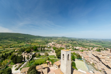 Fototapeta na wymiar Wide angle view of San Gimignano, a small walled medieval hill town in the province of Siena, Tuscany, north-central Italy, taken from the top of one of the towers