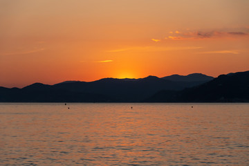 Beautiful bright sunset over the sea. Great travel view. Amazing nature paradise. Impressive summer panorama.