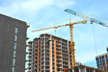 Crane and highrise construction site