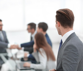 rear view. businessman looking at workplace