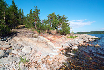 Picturesque coast of the island of Mussarat on lake Ladoga .