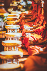 buddhist monks in a row